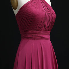 Magenta dress on a mannequin against a black background