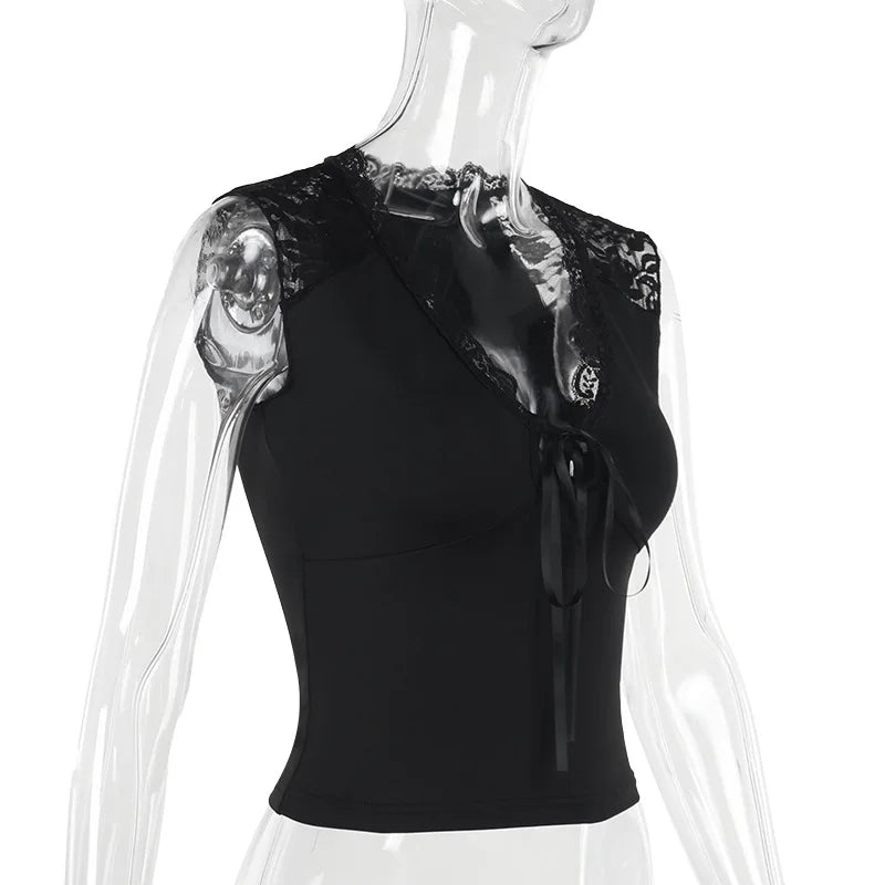 Black sleeveless top with sheer shoulder panels on a transparent mannequin