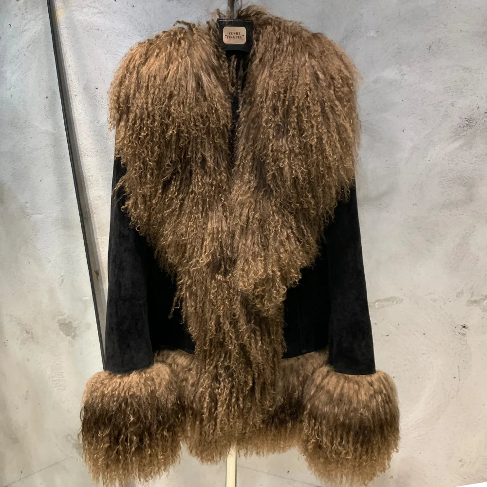 Brown fuzzy coat with black sleeves on a gray background