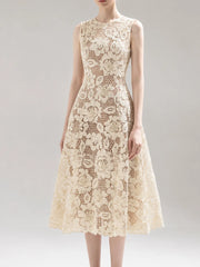 Close-up of intricate floral lace detail on sleeveless midi dress
