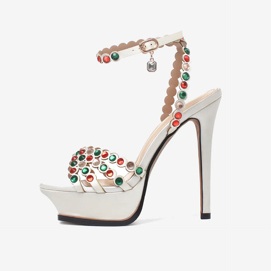 Platform crystal embellished stiletto heels in white satin with red and green crystals