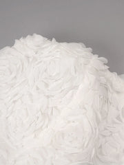 Close-up of white shaggy rug on a gray background