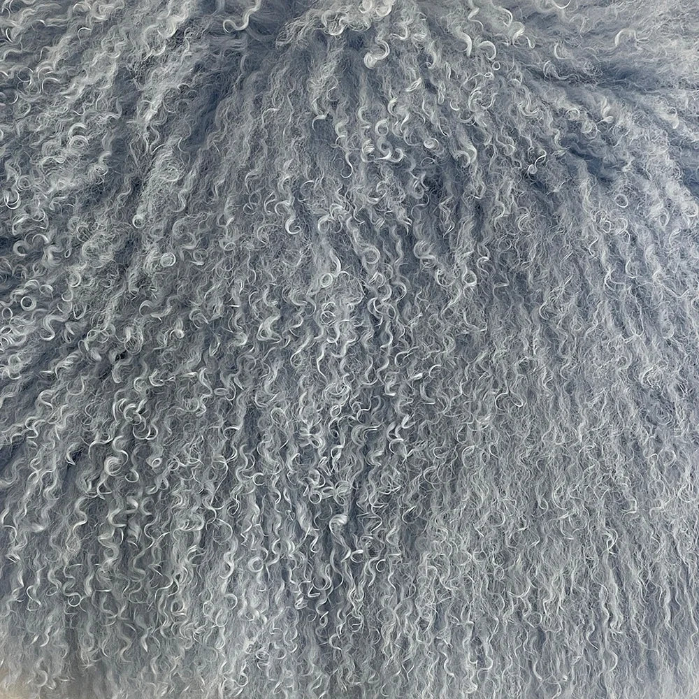 Close-up of wavy sand patterns on a beach