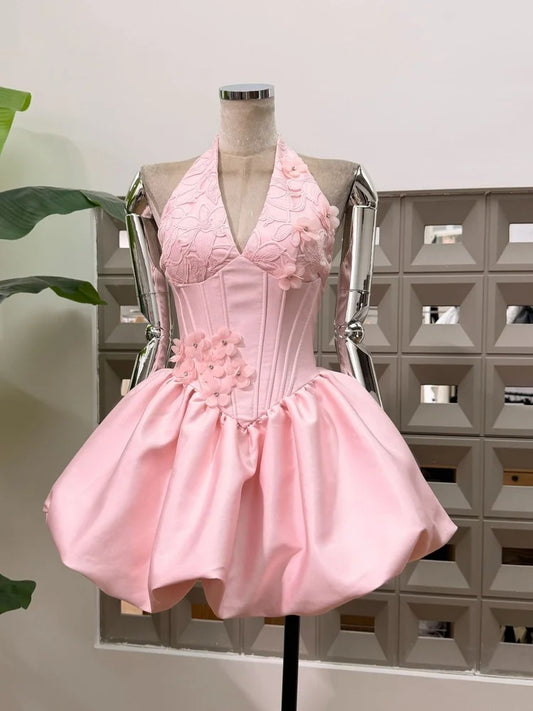 Pink appliqued floral halter mini dress with corseted bodice and bubble hem