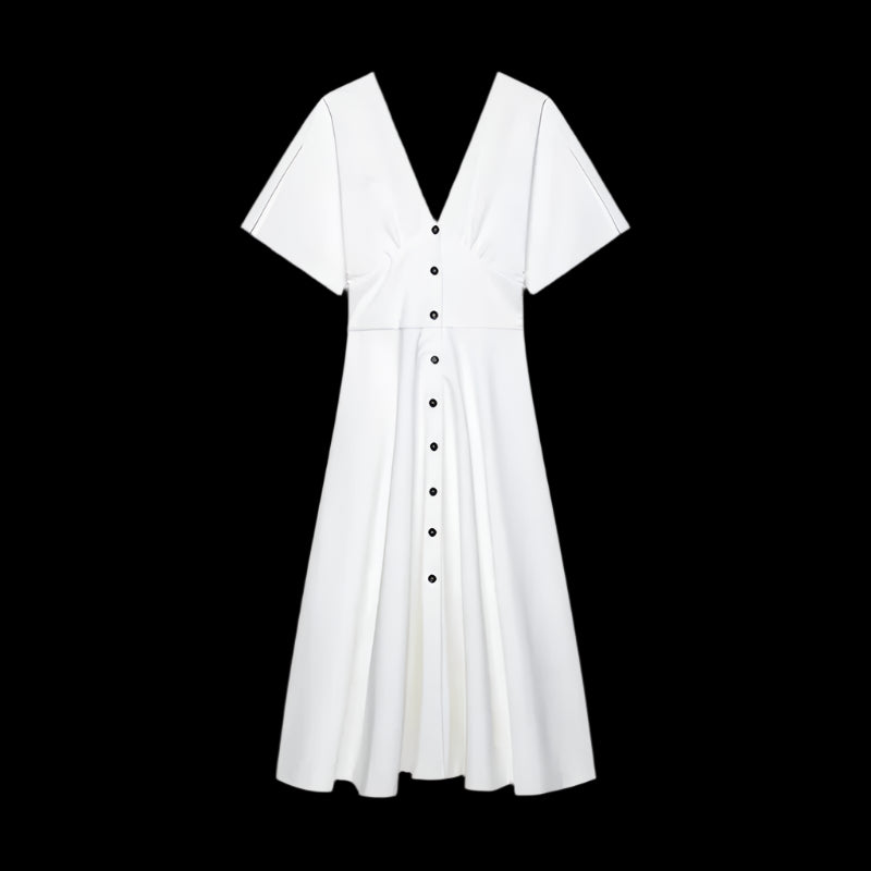 White dress with black buttons on a black background