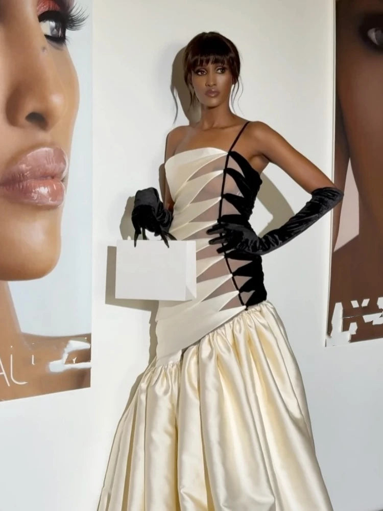 Woman wearing a strapless dress with sheer panels and black gloves, with close-up details of a face and product on the sides.