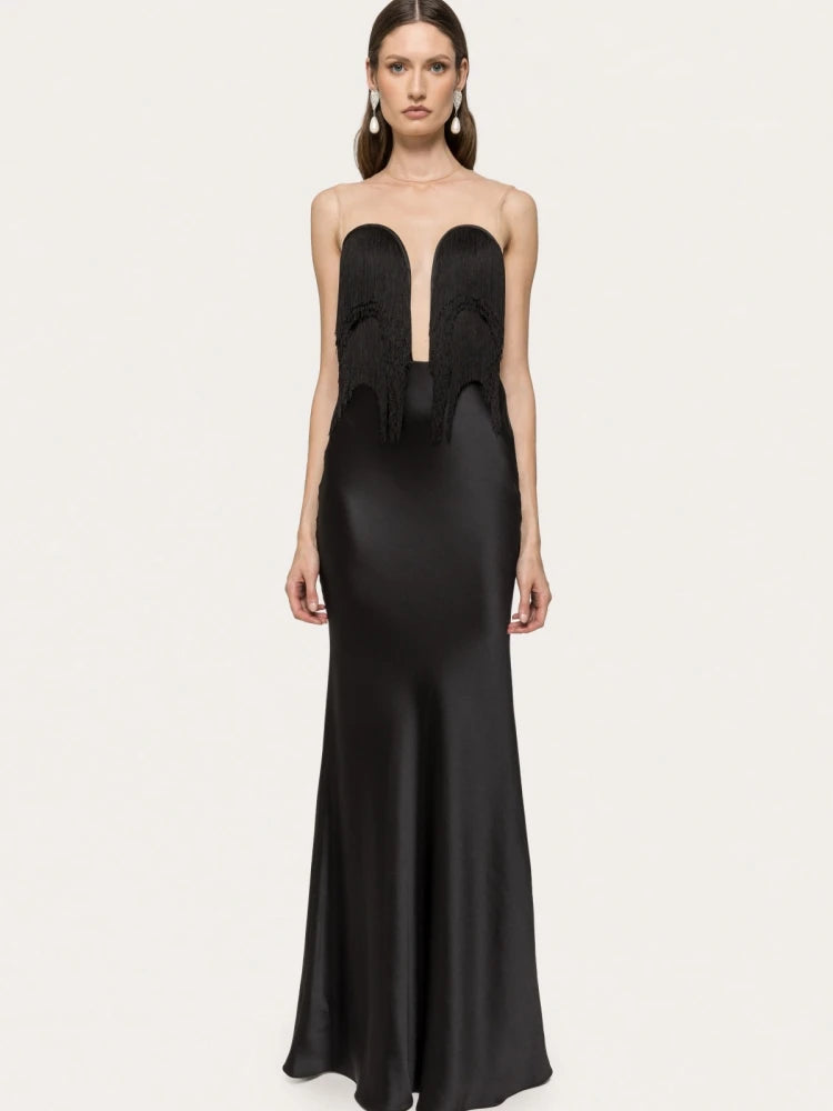 Black evening gown with cut-out design on a white background