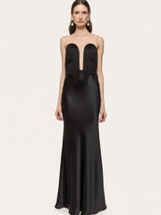 Black evening gown with cut-out design on a white background