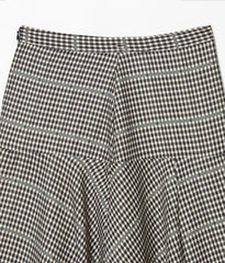 Black and white checkered pants on a light gray background