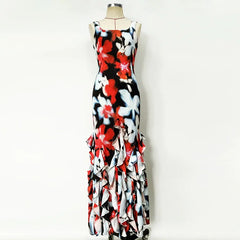 Colorful floral dress on a mannequin against a white background