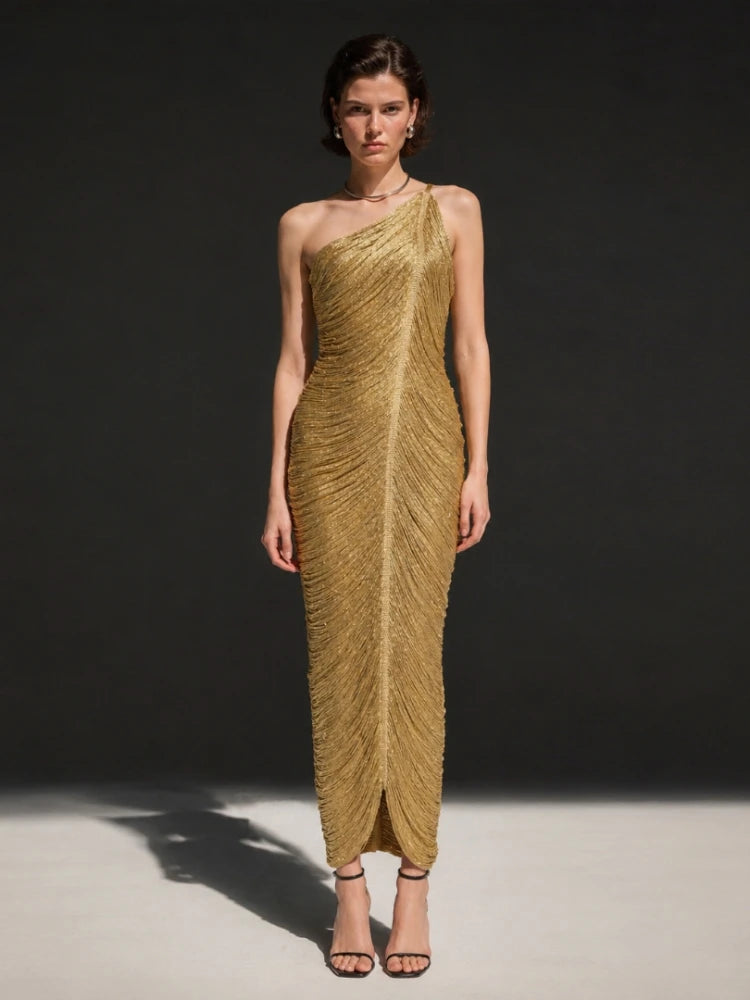 Model wearing a gold fringe one-shoulder midi dress from the front