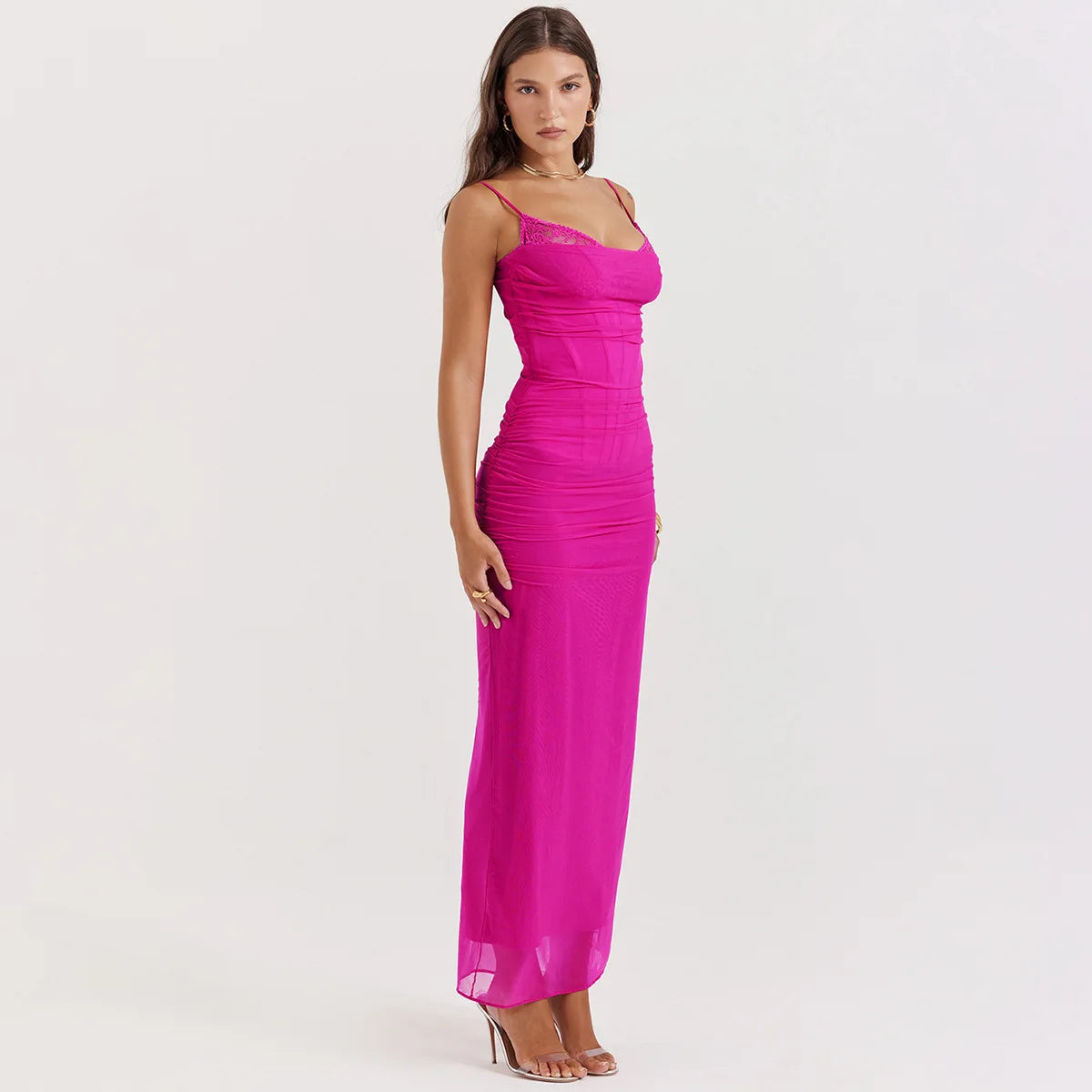 Woman wearing a Pink lace-trimmed sleeveless midi dress with V-neck and slim fit.