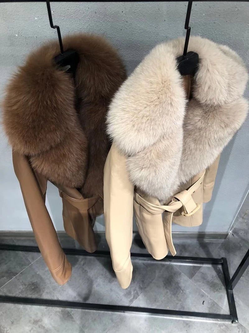 Two fur-stole accessories on a stand against a neutral background
