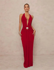 Red formal gown with a plunging halter neckline and draped waist.