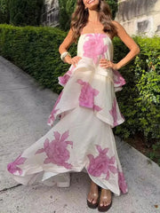 Woman posing in a floral print layered midi dress