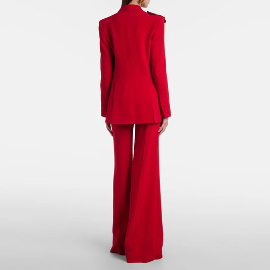 Back view of red suit jacket with floral detail and flared trousers