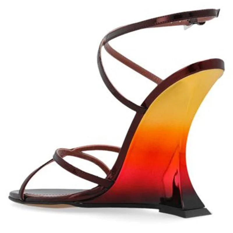 Side profile of a wine red gradient wedge heel sandal