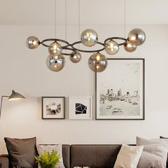 Magic Beans chandelier with smoke grey glass pendants hanging in a modern living room. Golden Atelier 2