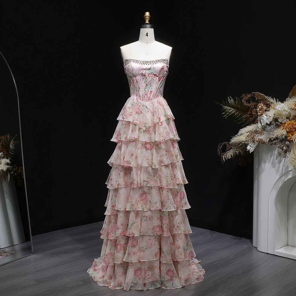 Floral tiered dress on a mannequin against a dark background