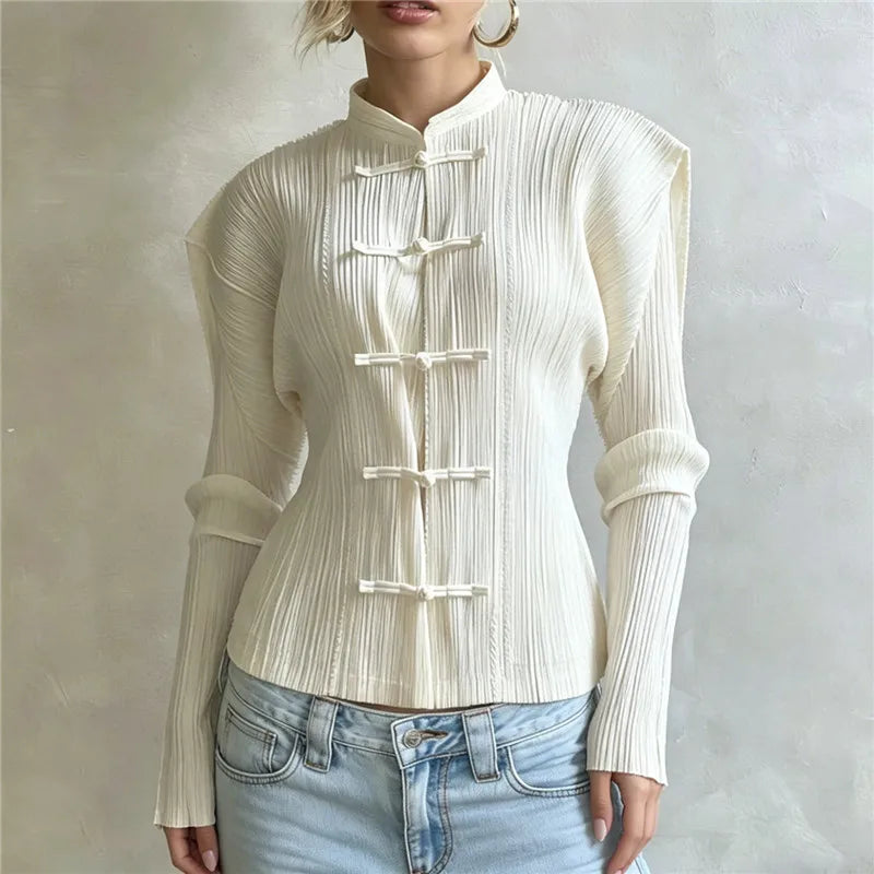 Close-up of a white mandarin collar pleated top