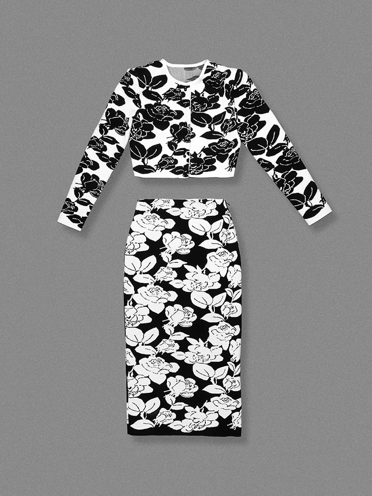 Black and white floral dress set on a gray background