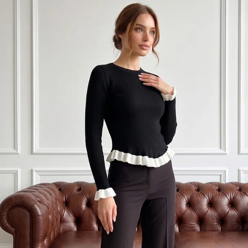 Ribbed knit top with ruffled trim in black