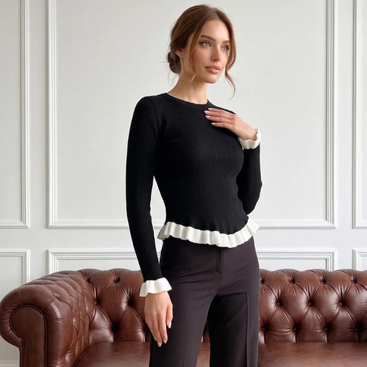 Ribbed knit top with ruffled trim in black