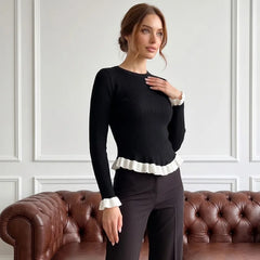 Ribbed knit top with ruffled trim in black