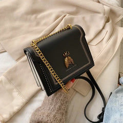 A stylish PU leather crossbody bag showcased against a neutral background, highlighting its elegant design and textured material.