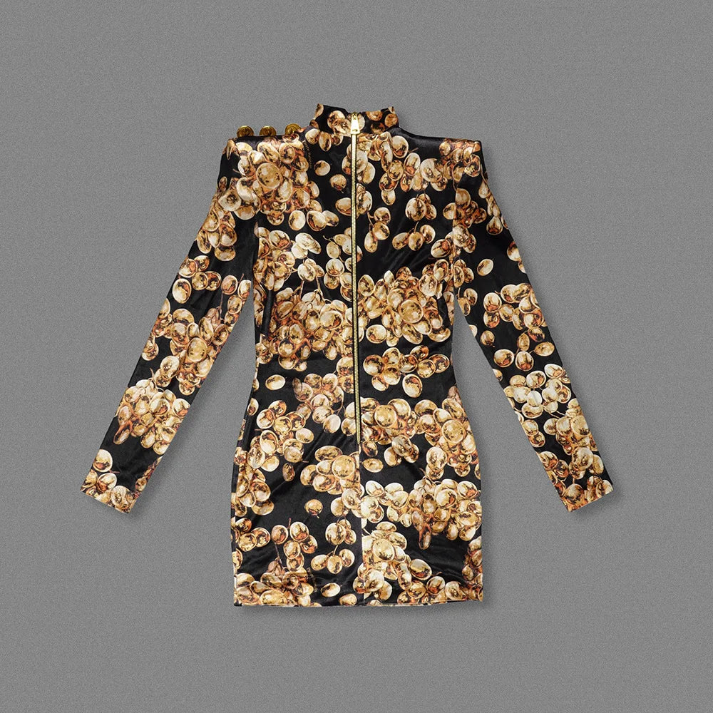 Black and gold floral patterned dress on a gray background