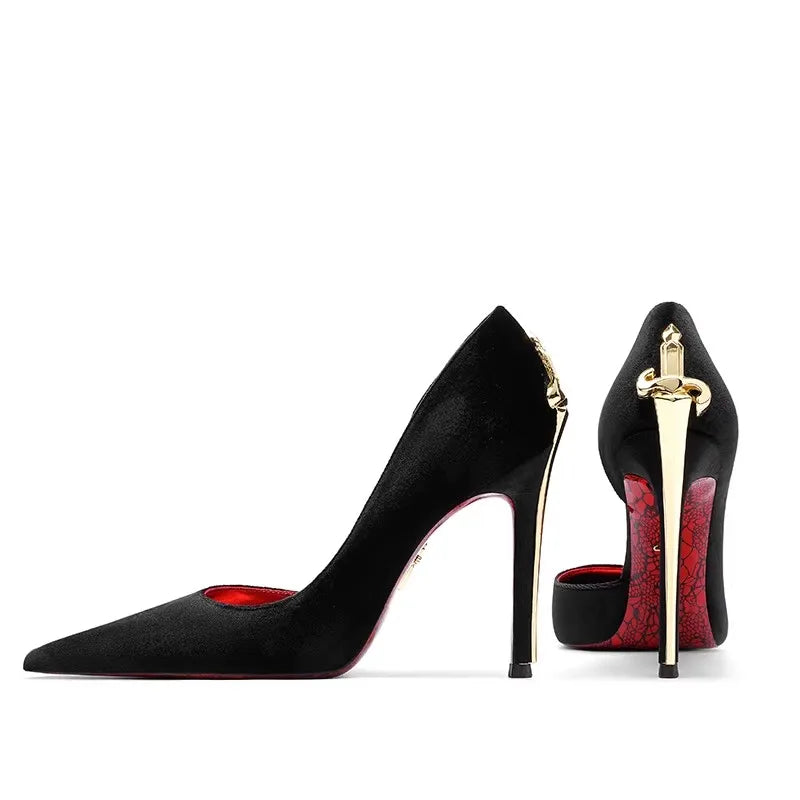 Black high-heeled shoes with red interior and gold accents on a white background