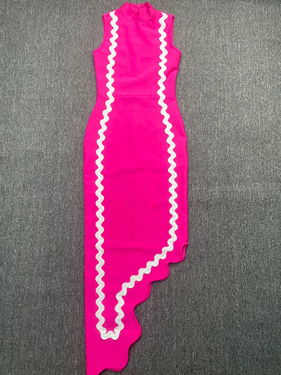 Pink dress with white ruffled trim on a gray background