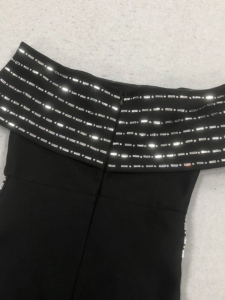 Black pants with reflective stripes on a light gray background