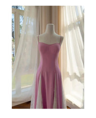Close-up of the bodice and lace detailing on a pink spaghetti strap midi dress.