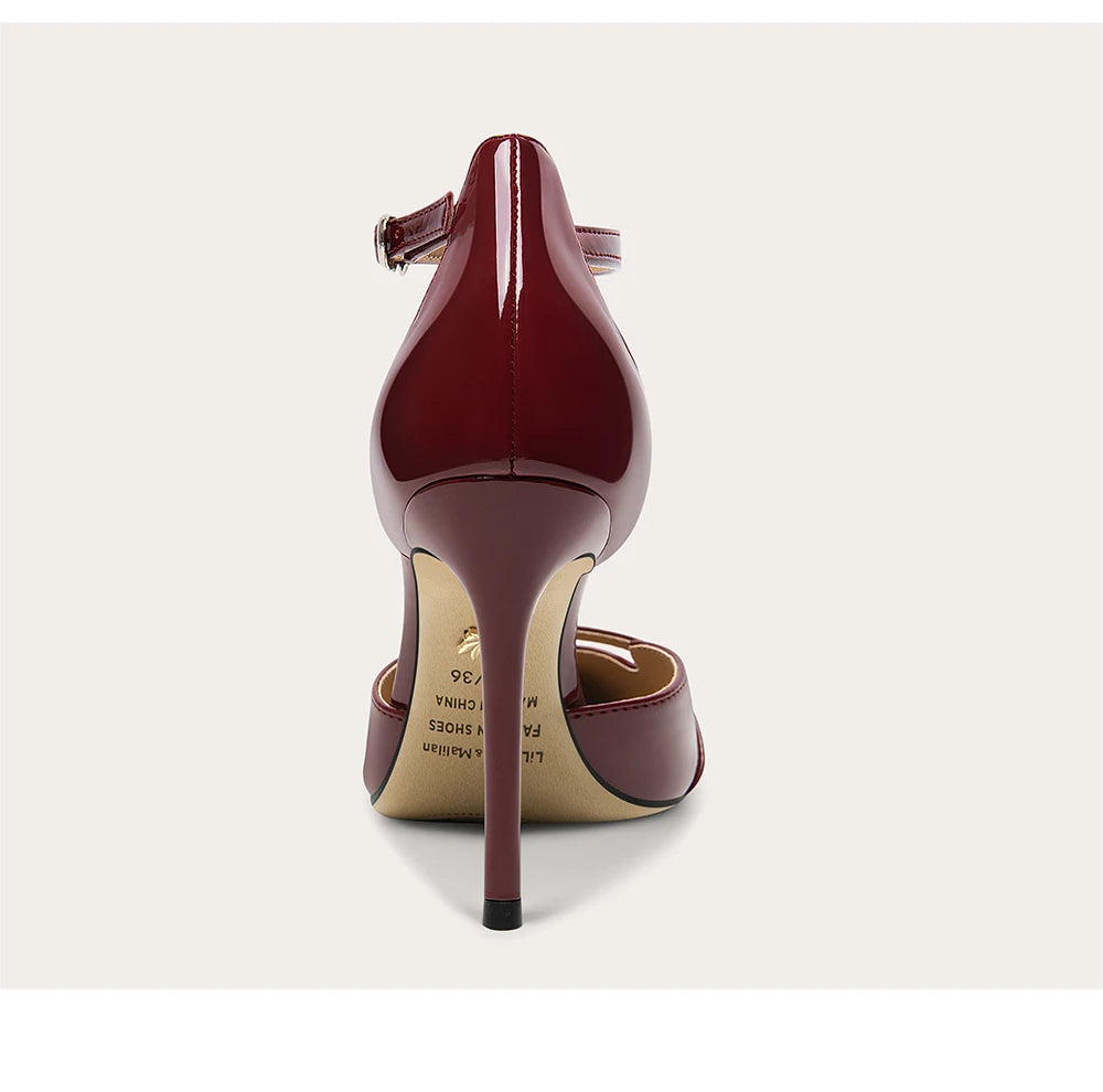 Maroon high-heeled shoe on a light gray background