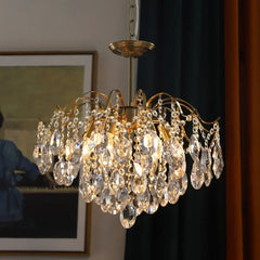   Close-up detail of the sparkling crystals and elegant curves of the chandelier. Golden Atelier 2