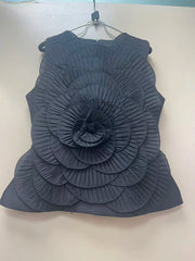 Dark blue sleeveless top with a floral design on a white background