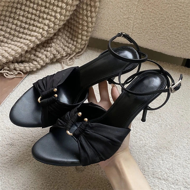 Black stiletto heel sandal with ruched mesh and ankle strap