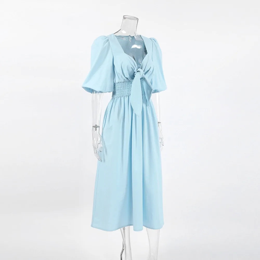 Light blue dress with a knot on a mannequin 
