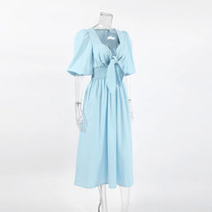 Light blue dress with a knot on a mannequin 