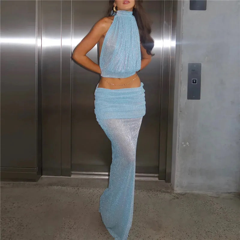 Back view of halter neck crop top and sheer ruched maxi skirt set
