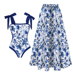 Blue floral print one-piece swimsuit with tie straps and blue floral maxi skirt