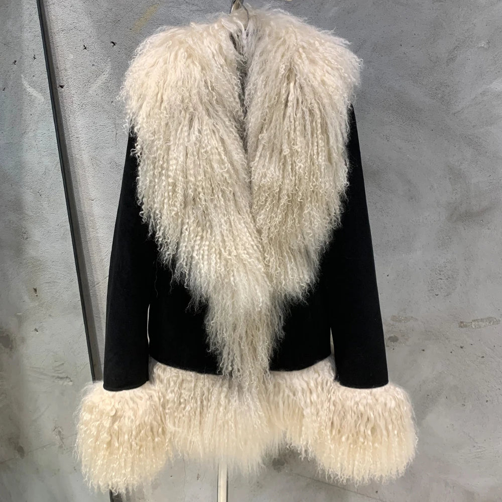 Black jacket with white fur trim on a gray background