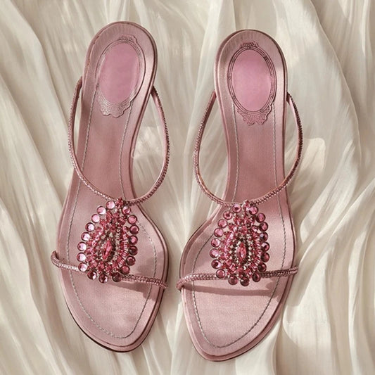 Pair of pink crystal embellished thin heel sandals.