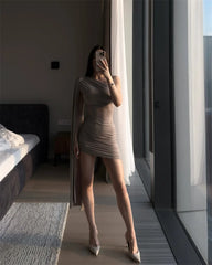 Elegant one shoulder drape mini dress in solid color.