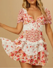 Woman wearing a floral dress with ruffles on a beige background