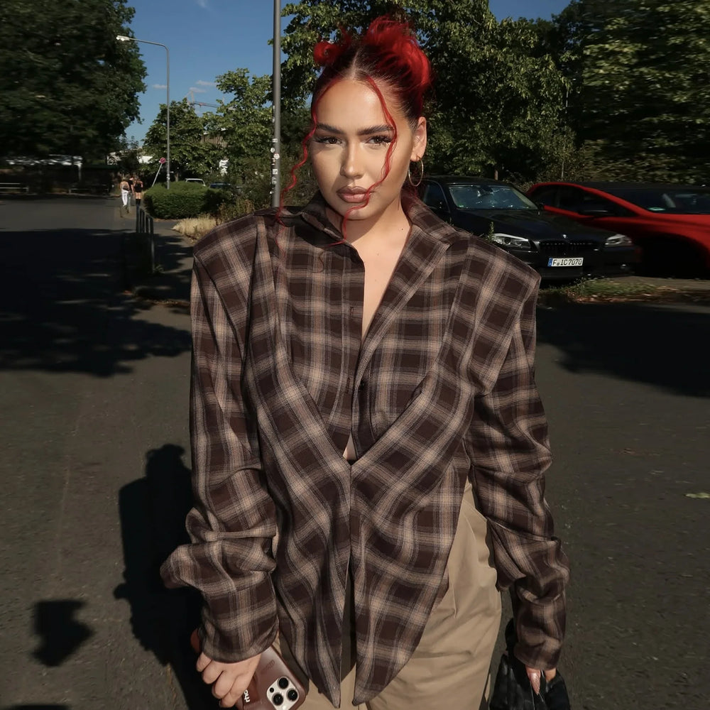 Side view of the loose-fit plaid shirt with cropped hem