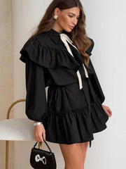 Black ruffled collar mini dress with bow tie and puff sleeves