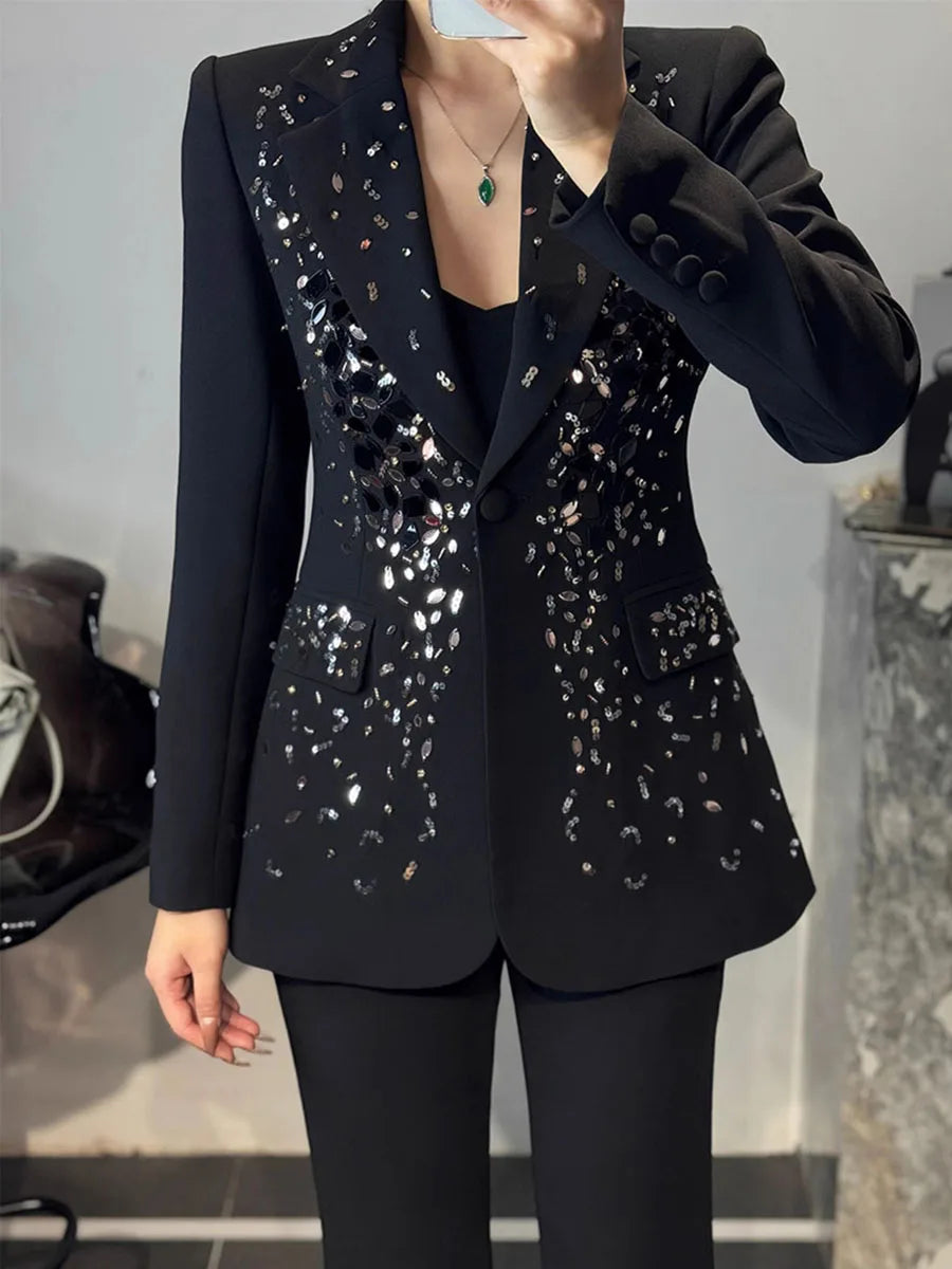 Black two-piece blazer and pant set with sequin embellishments