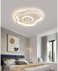 A modern LED ceiling fan with integrated light fixture, illuminating a stylish Dining room. Golden Atelier 18